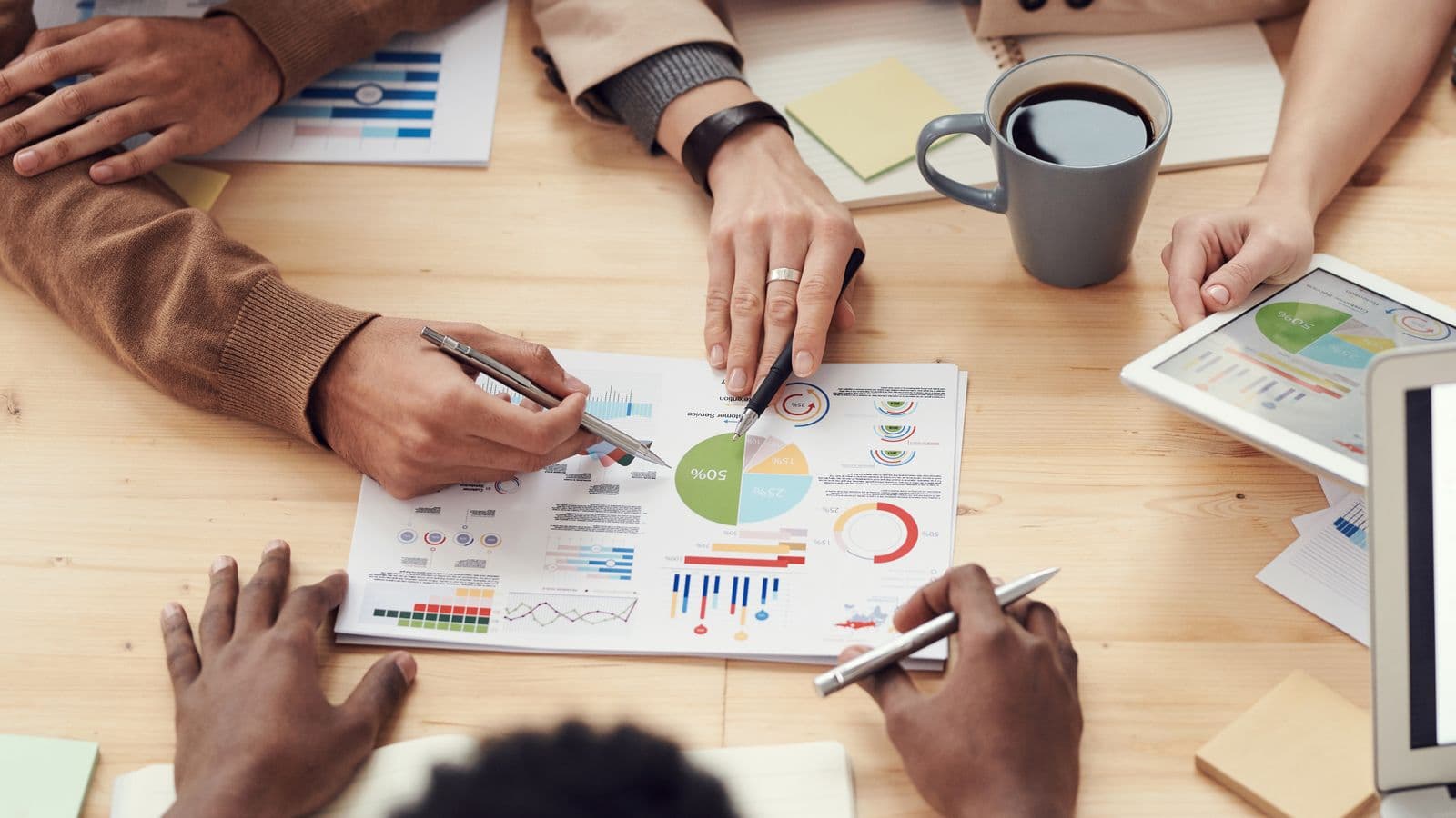 Accountants reviewing client documents at a desk