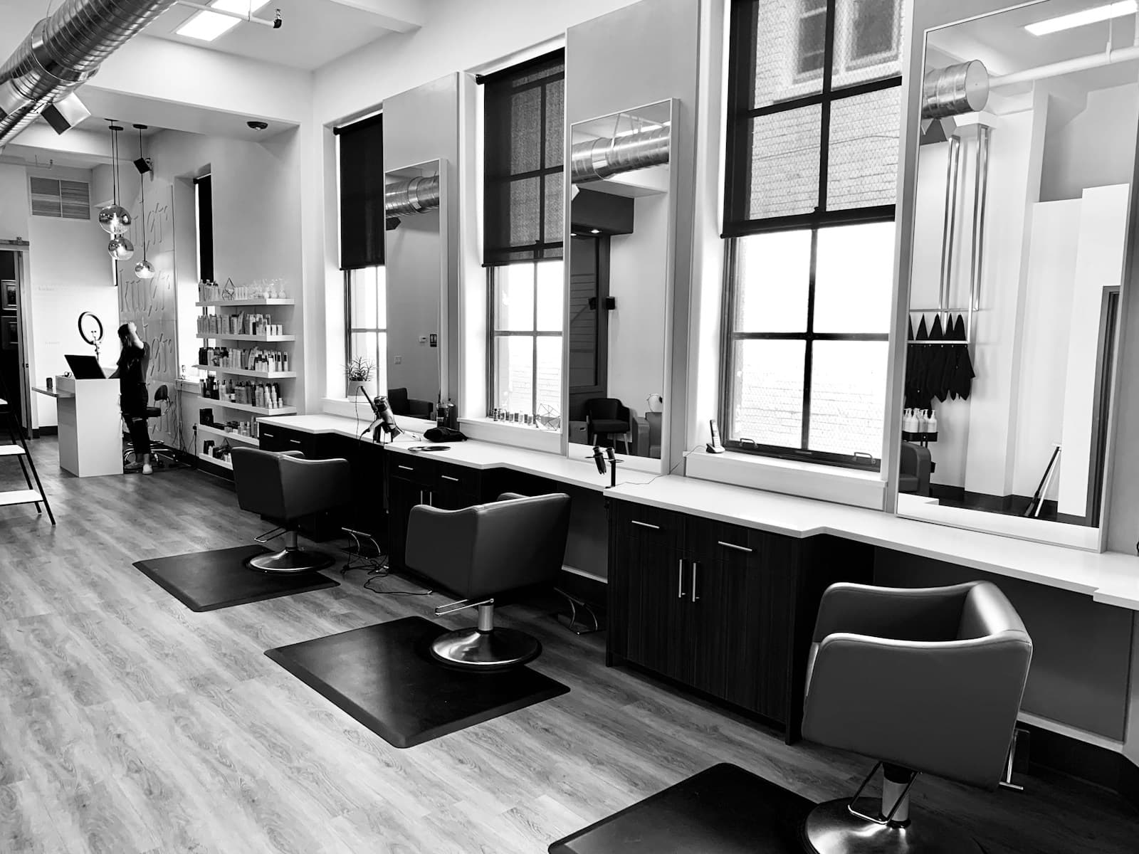 Hair stylist working with a client in a salon